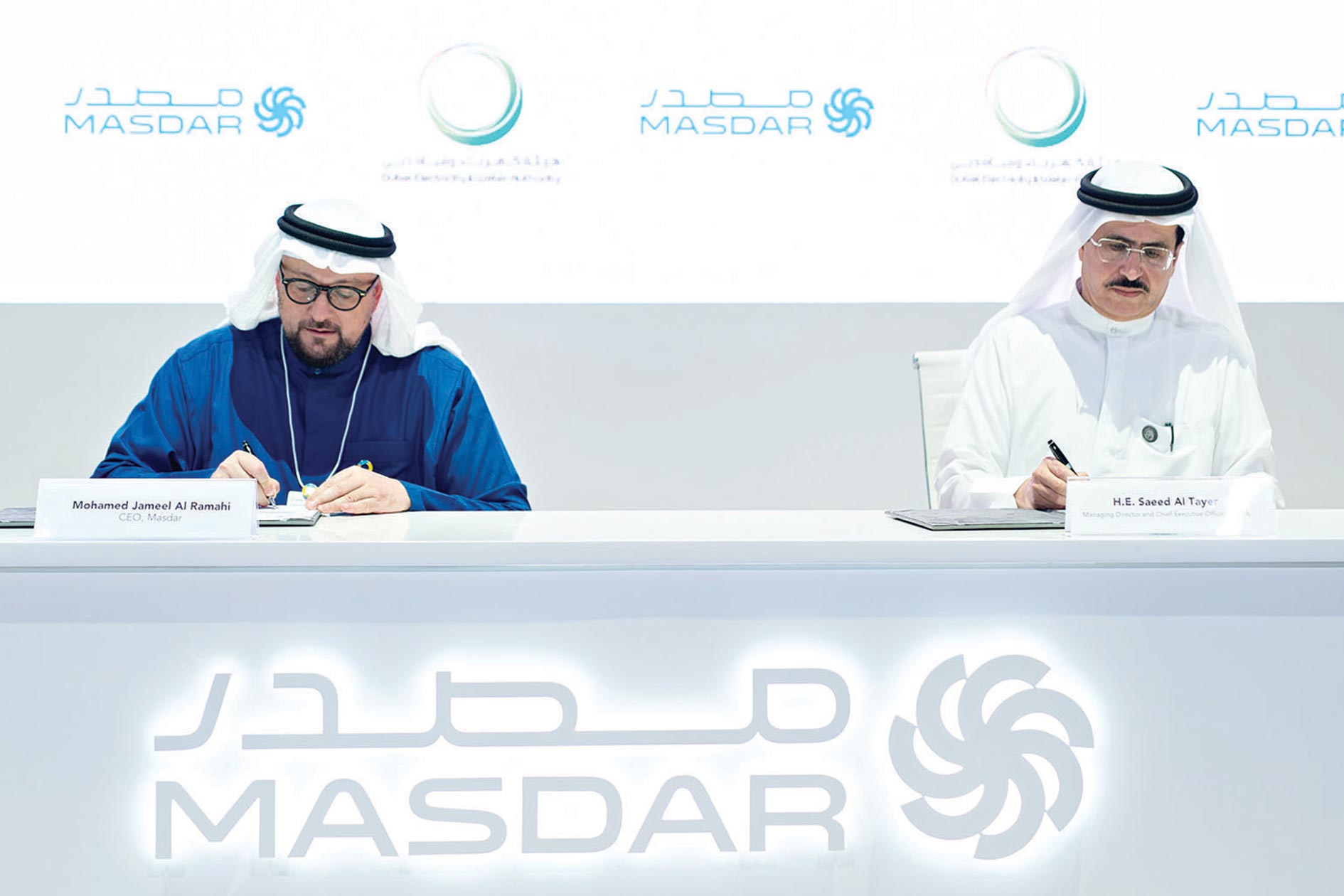 Saeed Mohammed Al Tayer and Mohamed Jameel Al Ramahi signing the agreement.