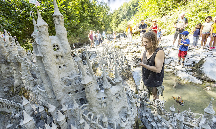 Swiss artist sculpts sprawling model castle on dried river bank - GulfToday