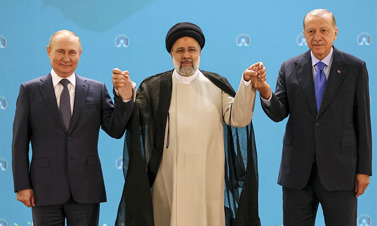 Russian President Vladimir Putin, left, Iranian President Ebrahim Raisi, center, and Turkish President Recep Tayyip Erdogan pose for a photo at the Saadabad palace, in Tehran, Iran. AP