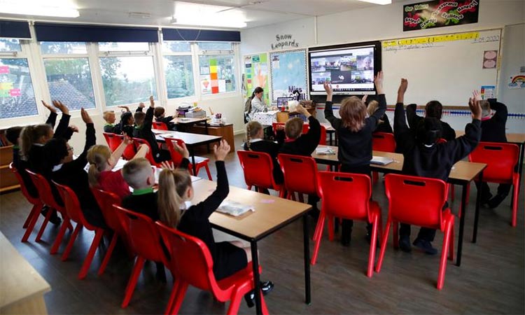 Students attend their class at a British school.