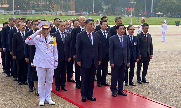 Chinese President Xi Jinping attends a lay wreath ceremony at the Ho Chi Minh mausoleum during a two day state visit to Hanoi, Vietnam. Reuters