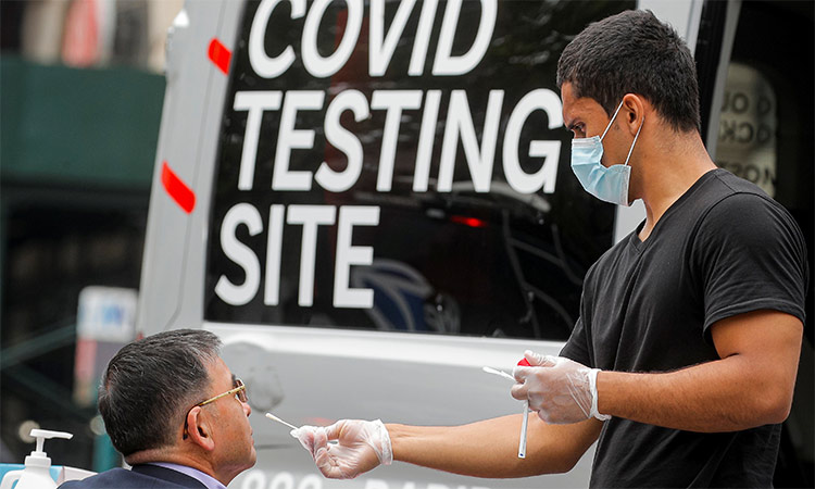 A man receives a coronavirus disease (COVID-19) test at a mobile testing van in Brooklyn, New York. Reuters