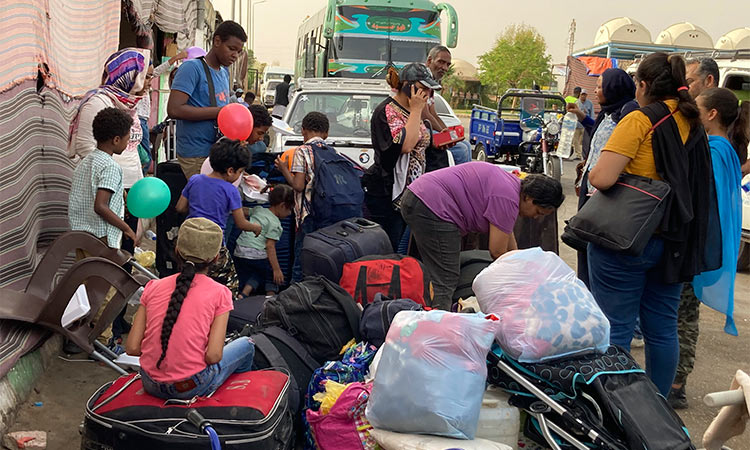 A Sudanese family, who fled the fighting in the Sudanese capital, has just arrived at the Karkar bus terminal in Egypt’s southern province of Aswan.  Associated Press