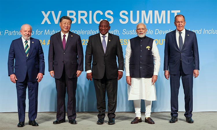 The BRICS leaders pose for a group photograh.