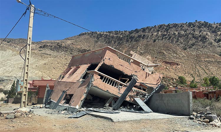 A collapsed house is seen on a road following a powerful earthquake in Morocco. Reuters