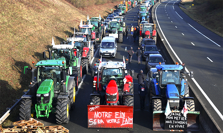 Tractors and other vehicles queue on the A16 highway as French farmers try to reach Paris during a protest over price pressures, taxes and green regulation, grievances shared by farmers across Europe, in Beauvais, France. Reuters