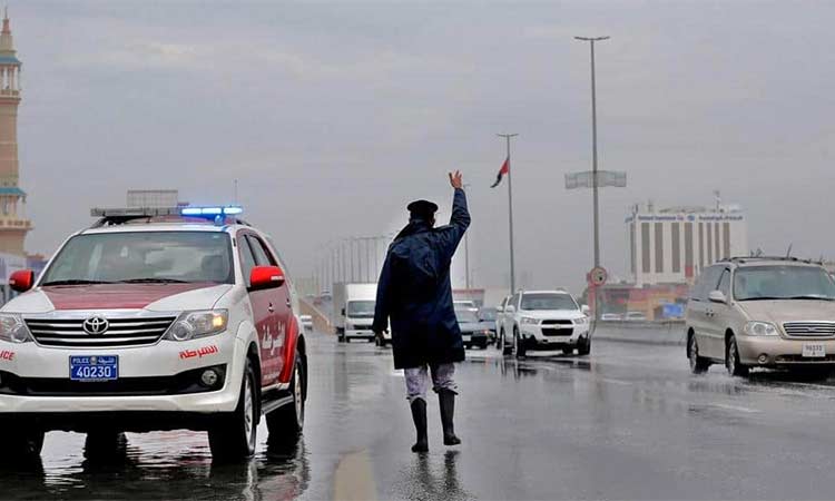 A policeman guides the traffic on a road in Ras Al Khaimah. 
