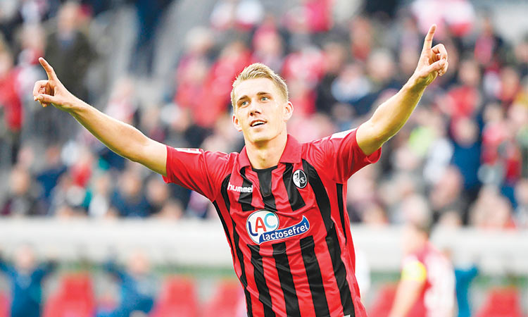 Freiburg move up to third after  comeback win at Duesseldorf