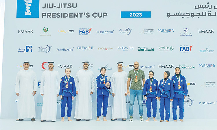 Winners pose with their medals and dignitaries during the award ceremony.