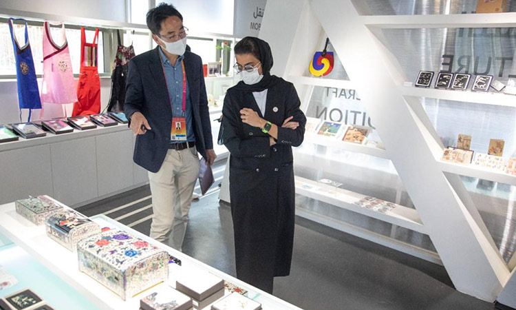 Noura Al Kaabi is being briefed at the South Korean Pavilion.