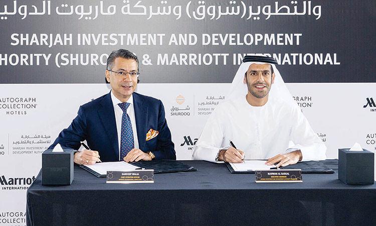 Marwan Bin Jassim Al Sarkal and Sandeep Walia during the signing ceremony at House of Wisdom.