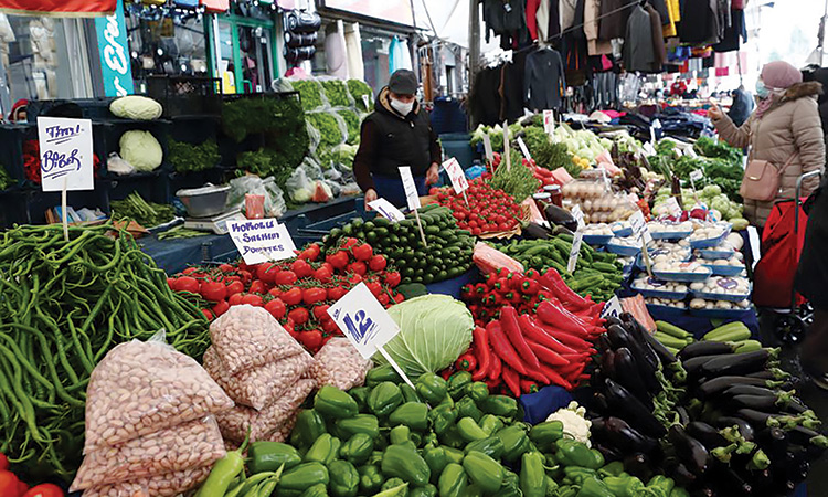 People shop at a local market in Fatih district in Istanbul, Turkey.