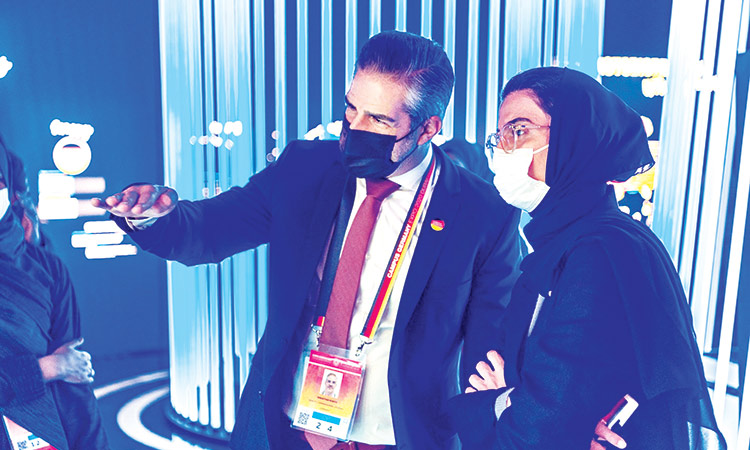 Noura Bint Mohammed Al Kaabi gets a briefing from an official during her visit to the German pavilion at the Expo 2020 Dubai.