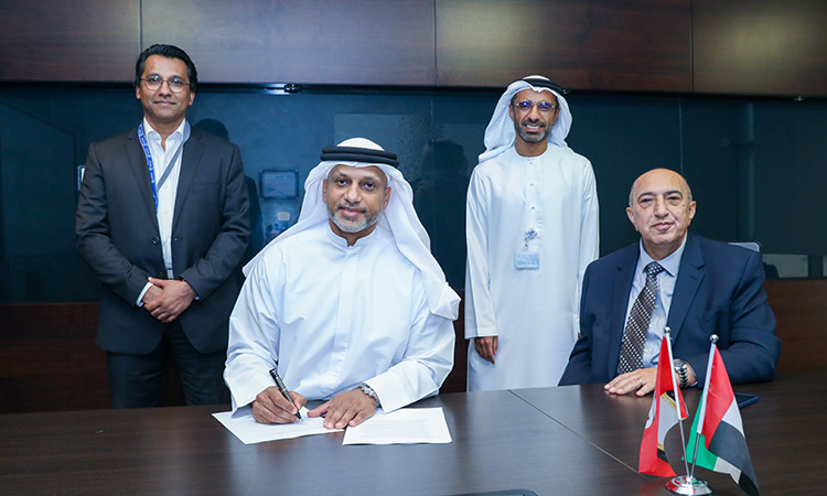 Officials of Emirates Steel and SNIM signing the MoU.