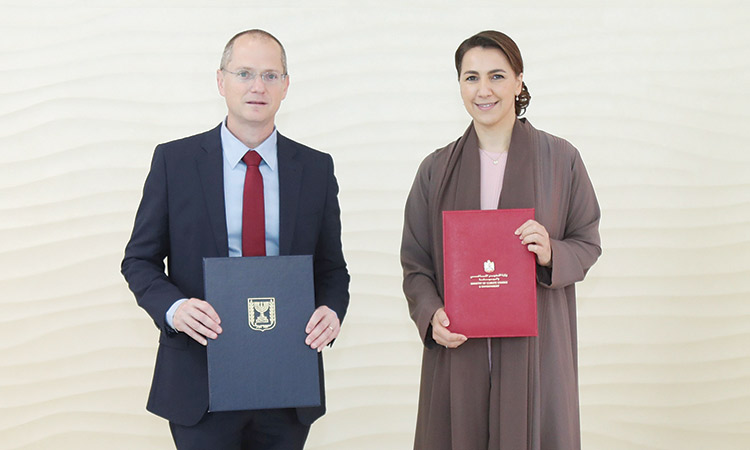 Mariam Bint Mohammed Almheiri and Oded Forer after signing the agreement at MoCCAE’s headquarters in Dubai.