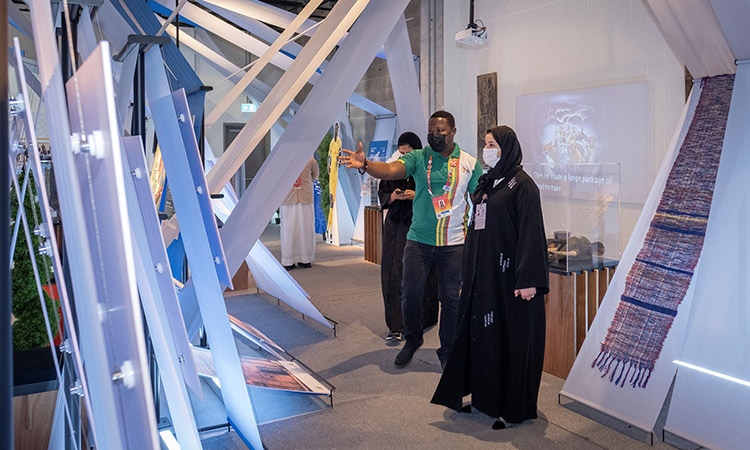 Sarah Al Amiri is being briefed during her visit to Togo pavilion at Expo 2020 Dubai on Wednesday.