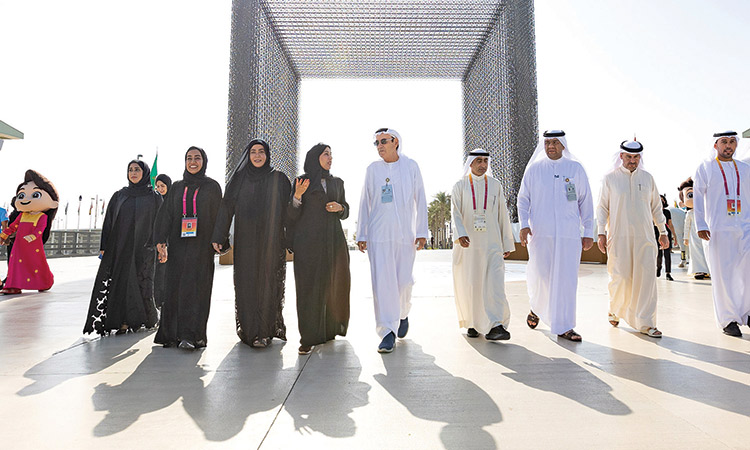 Hessa Buhumaid and Zaki Nusseibeh with dignitaries after opening the Sustainability Gate marking International Day of Happiness celebrations.