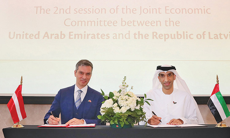 Dr Thani Bin Ahmed Al Zeyoudi and Raymonds Lapins during the signing of the agreement.