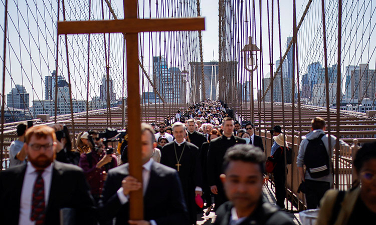 People participate in the “Way of the Cross Over the Brooklyn Bridge Ceremony” to mark the Good Friday in New York, US, on Friday.  Reuters