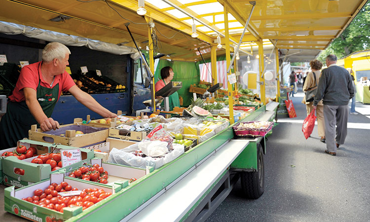A salesman waits for customers on a farmer’s market in the northern German town of Hamburg. Reuters