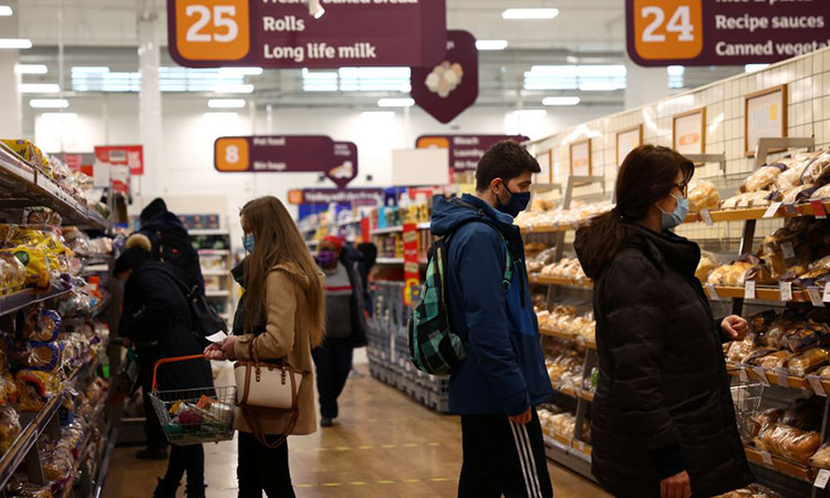 People shop at a supermarket in London. File/Reuters