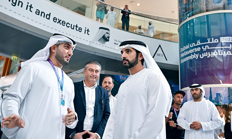 Sheikh Hamdan gets a briefing on the first day of the Dubai Metaverse Assembly. WAM