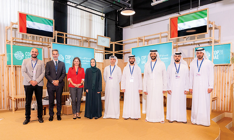 Abdulla Bin Touq Al Marri and other dignitaries after the event at COP28 in Dubai.