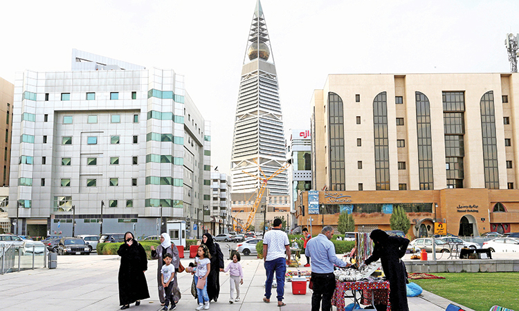 Visitors walk near the King Fahd Library in Riyadh, Saudi Arabia. Reuters