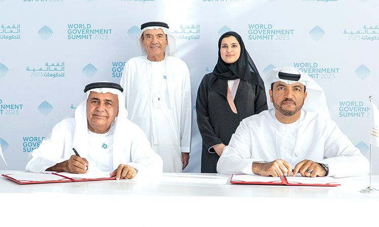 Sarah Al Amiri and Zaki Anwar Nusseibeh witness the signing ceremony in Dubai on Wednesday.