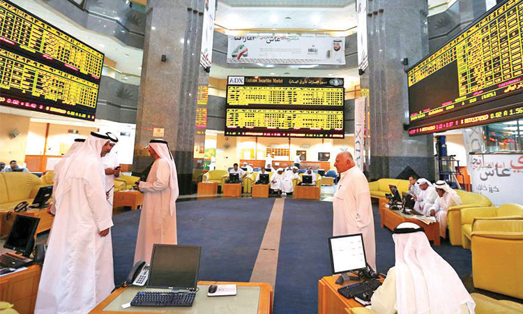 Traders work on the floor of the  Abu Dhabi Securities Exchange.  File/Reuters