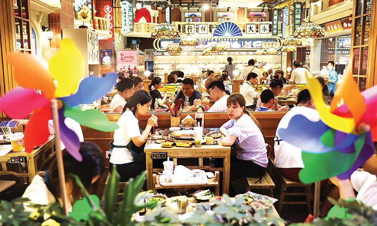 Customers dine at a restaurant in a shopping area in Beijing. File/Reuters
