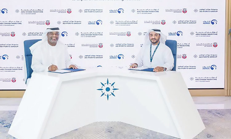 Officials of Abu Dhabi Maritime and Adnoc Distribution during the signing ceremony.
