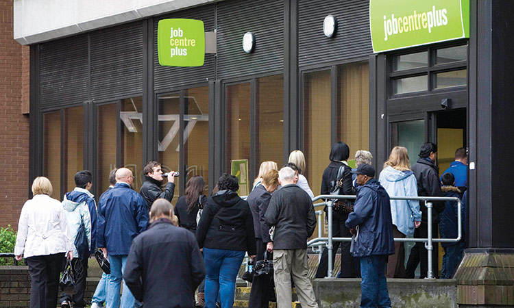 People enter a job centre in London, UK.  File/ Reuters