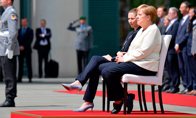 Merkel-sits-during-anthem-750x450