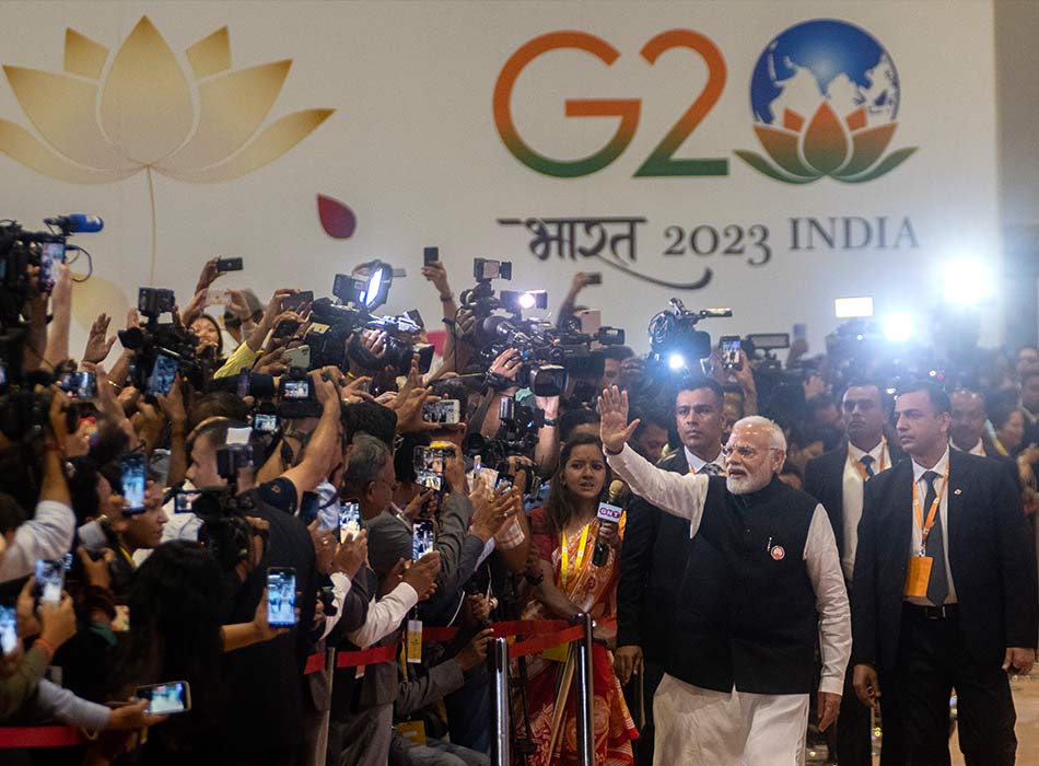 Modi waves during his visit to the International Media Center at the end of the G20 Summit in New Delh on Sunday. AP
