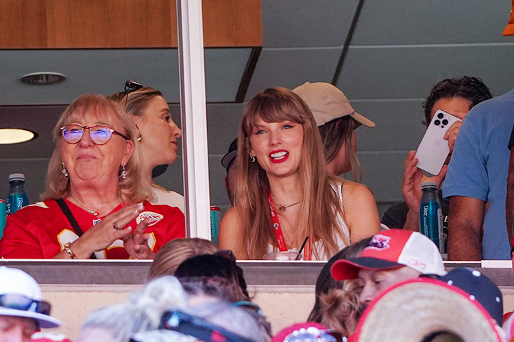 Taylor Swift reacts while sitting next to Donna Kelce watching the Kansas City Chiefs vs Chicago Bears game at Arrowhead Stadium.