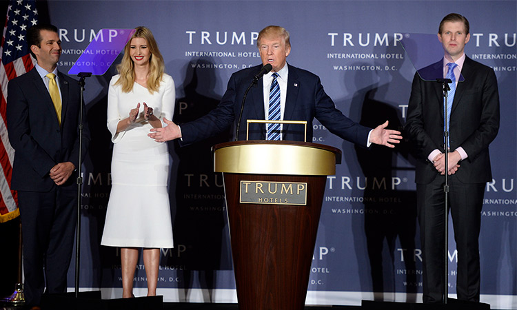 Donald Trump delivers remarks with his children (from left) Donald Trump Jr., Ivanka Trump and Eric Trump at a ribbon cutting ceremony at Trump International Hotel in Washington. 