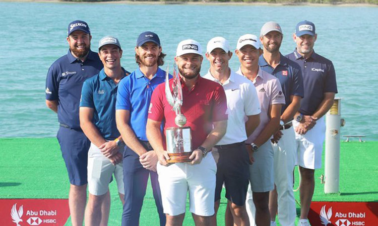 Tyrrell Hatton holds the trophy as others look on the eve of the Abu Dhabi Golf Championship. courtesy: Twitter