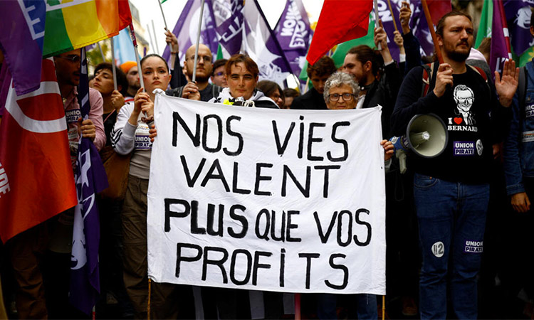 People protest over rising cost of living and unemployment in Paris.