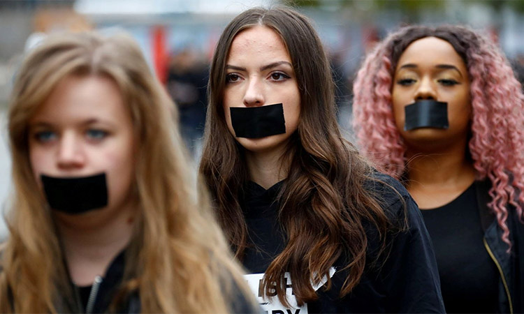Women attend a protest against human trafficking in Berlin. Reuters