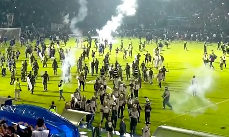 The riots occurred after angry fans invaded a football pitch after a match in East Java. Reuters