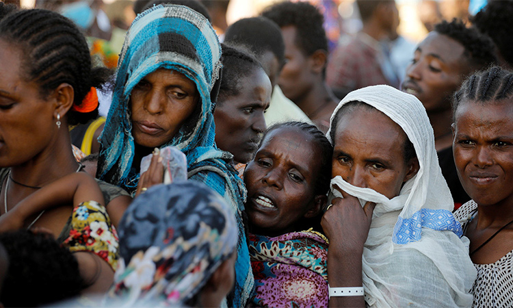 Refugees who fled the fighting in Tigray stand in line for supplies at the Um Rakuba camp near the Sudan border. Reuters