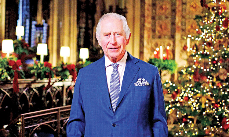 Britain’s King Charles III delivers his message during the recording of his first Christmas broadcast in the Quire of St George’s Chapel at Windsor Castle, Berkshire, England on Tuesday.  Associated Press