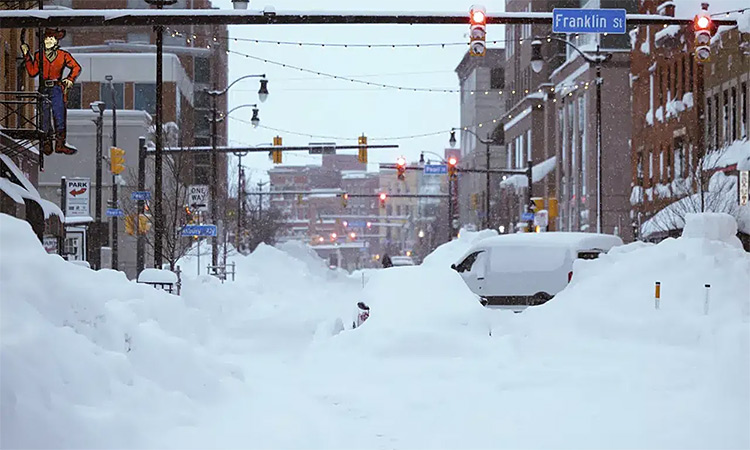Snow from this weekend's blizzard covers downtown Buffalo. The blizzard stranded motorists, knocked out power and prevented emergency crews from reaching residents in frigid homes and stuck cars. AP