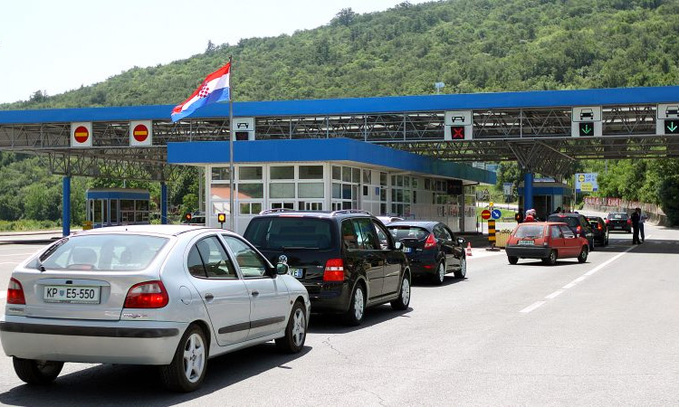 Cars queue up at the official temporary border between Croatia and Slovenia at the Piran Bay.