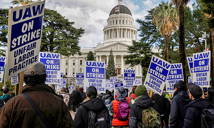 Hundreds of University of California graduate workers and supporters carry on a strike to decry the university’s treatment toward students and employees in Sacramento, California.  File/AP
