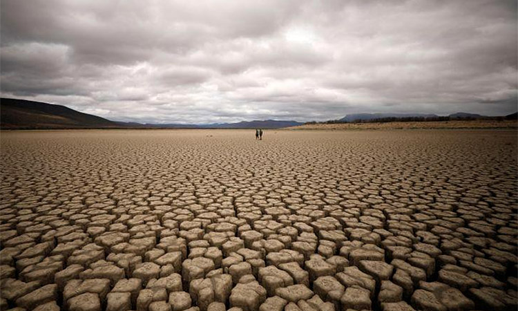 Clouds gather over the dried-up land of municipal dam in drought-stricken Graaff-Reinet, South Africa. Reuters