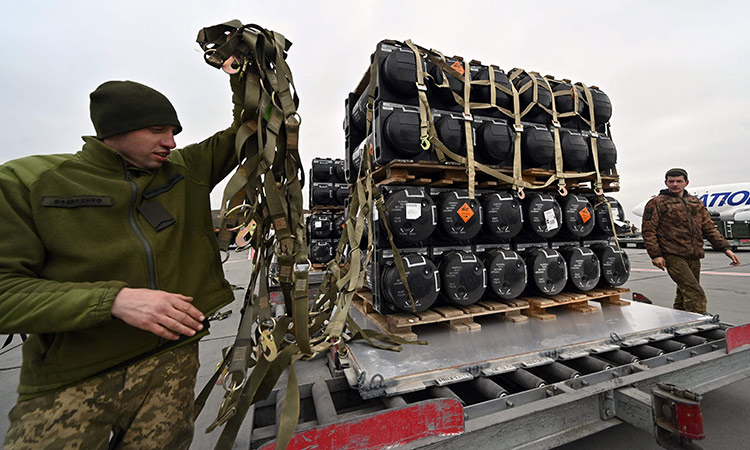 Ukrainian servicemen unload anti-tank missiles provided by the US to Ukraine at Kyiv’s airport Boryspil. AFP