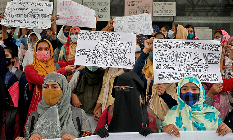 Muslim students display placards during a protest against the recent hijab ban in few colleges of Karnataka, India. Reuters