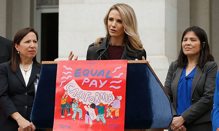 Jennifer Siebel Newsom (center), wife of California Gov. Gavin Newsom, calls for equal pay for women during a news conference in Sacramento. File/AP